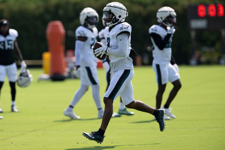 Eagles cornerback Darius Slay practicing at training camp while wearing a Guardian Cap.