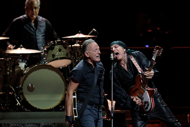 Bruce Springsteen performs with Steven Van Zandt (right) and drummer Max Weinberg (left) during the Bruce Springsteen and The E Street Band 2023 tour stop at the Wells Fargo Center on March 16, 2023.