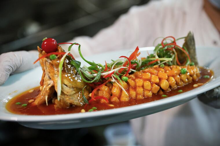 The crispy whole boneless sea bass with pine nuts at EMei in Chinatown.