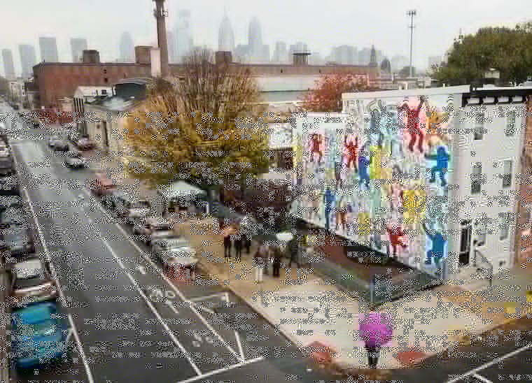 "We the Youth," a Keith Haring mural at 22nd and Ellsworth Streets, has been restored to its original vibrancy and will be maintained by the Philadelphia Mural Arts Program.