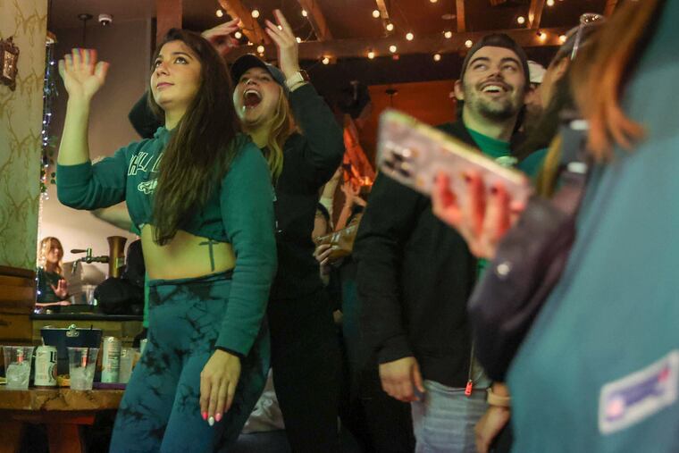 Eagles fans watch a game at Brü Craft & Wurst in Center City. 