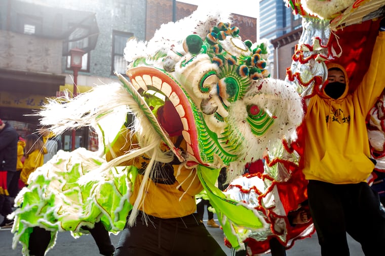 A member of the Philadelphia Suns performs in a lion costume at the Chinese Lunar New Year Parade in 2019.