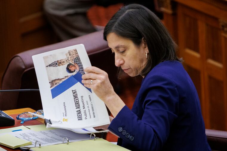 City Councilmember Rue Landau looks at Parker administration documents about the arena during a hearing in November.