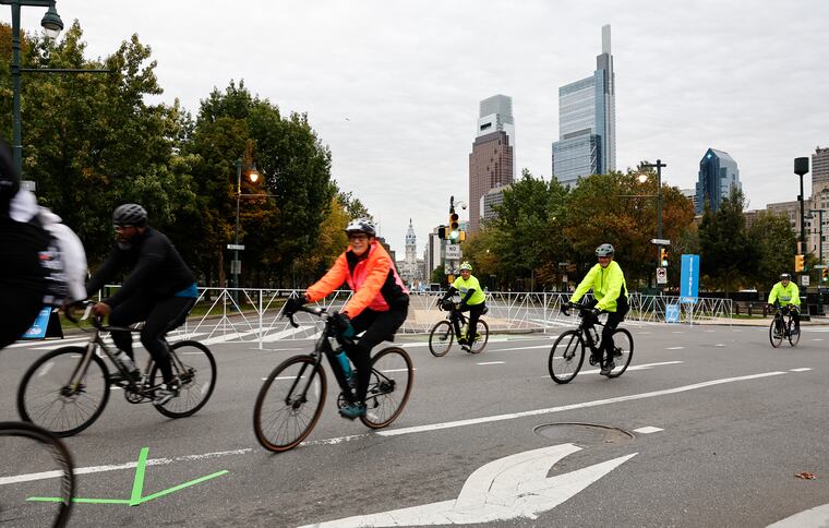 Philly Bike Ride 2023 participants turn onto the Benjamin Franklin Parkway from 22nd Street on Saturday morning, October 14, 2023.  The event celebrates cycling and riding in the city in a car-free environment.