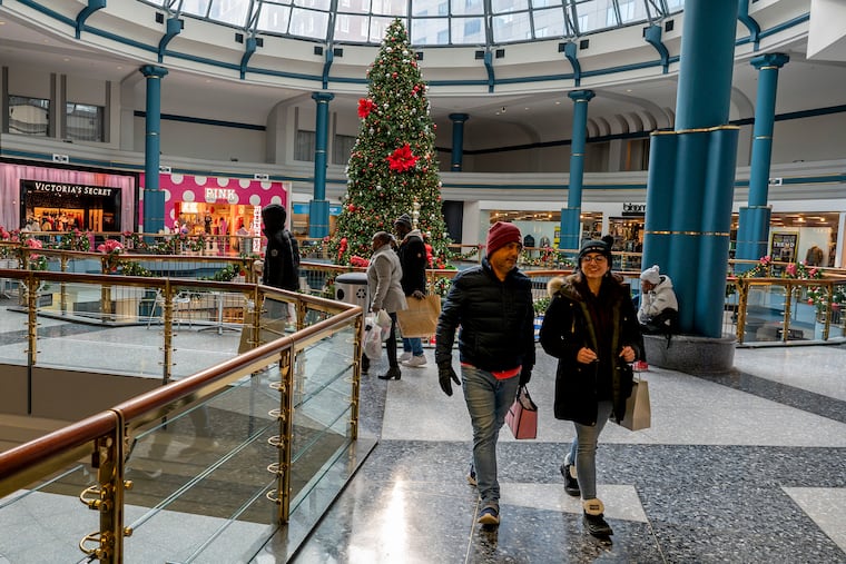 Shoppers (no IDs) at the Shops at Liberty Place Nov.14, 2021. Health experts are telling us it's safe to gather this Christmas with family and friends, as long as people are vaccinated. So now comes something else to kill the joy of the holiday season: inflation.