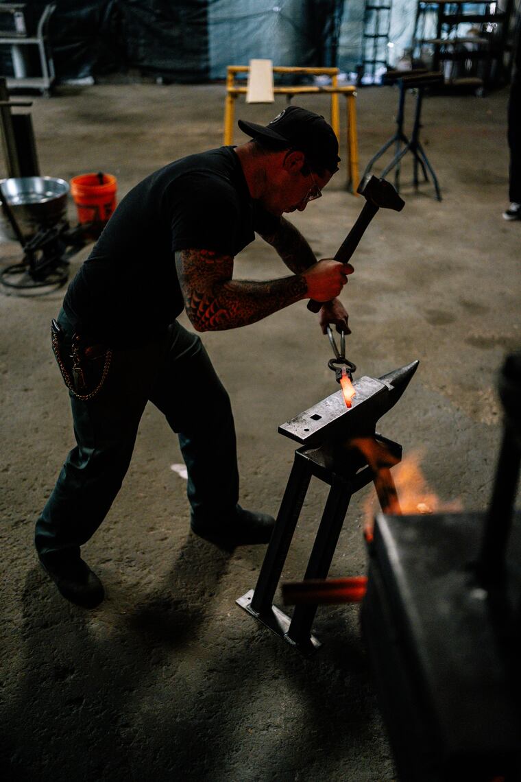 Knifemaker Steve Pellegrino works on a chef's knife in his Buck's County workshop.