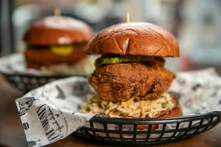 The O.G. chicken sandwich (front) and spicy Nashville hot chicken sandwich at Love & Honey Fried chicken.