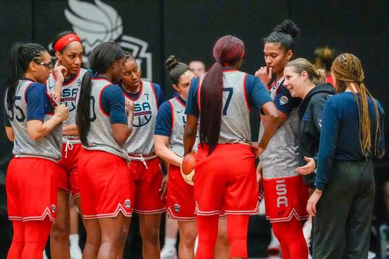 Cheryl Reeve (second from right) speaks to her players after practice during the USA team's training camp Feb. 4.