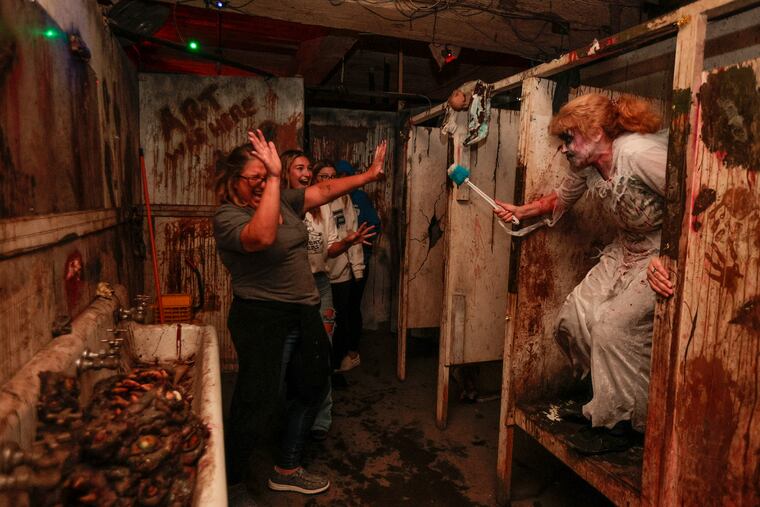 Charmaine Warrington, a 52-year-old haunter at Fright Factory in South Philly, scaring visitors at the attraction. Friday October 6, 2023.