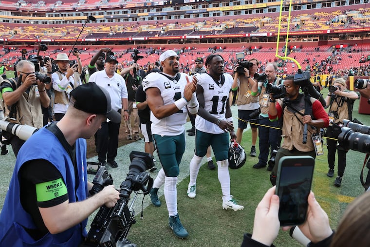 Philadelphia Eagles quarterback Jalen Hurts and Philadelphia Eagles wide receiver A.J. Brown walk off the field after beating the Washington Commanders 38-31at FedEx Field on Sunday, Oct. 29, 2023, in Landover, Md.