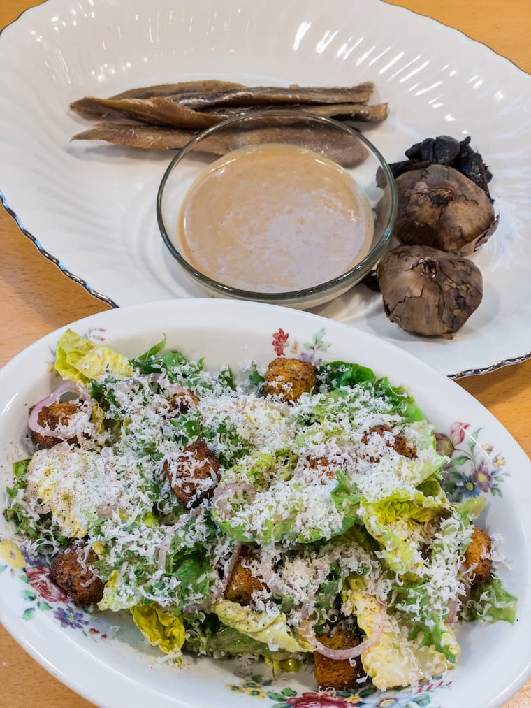 The Black Caesar salad at Honeysuckle Provisions subs anchovies with smoked herring, a celebrated ingredient in Haitian gastronomy, and a 9- to 12-day fermented black garlic from resident fermenting specialist Jamaar Julal.