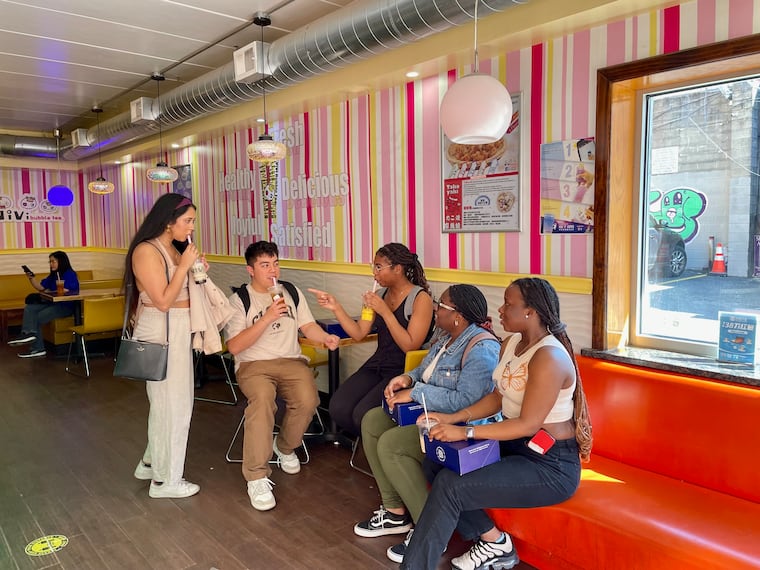 Matthew Rodriguez and friends sit at Vivi Bubble Tea in Chinatown.