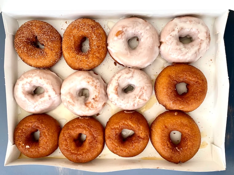 A mixed dozen of hot doughnuts from Brown's Restaurant in Ocean City includes, clockwise from top left, cinnamon sugar, vanilla glazed and honey-dipped.