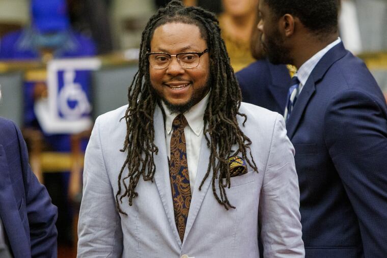 City Councilmember Jeffery Young Jr. stands in Council's chambers during a meeting in June.