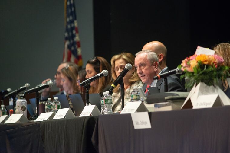 Members of the board at the start of the public comment portion of a school board meeting at Central Bucks West High School in Doylestown.