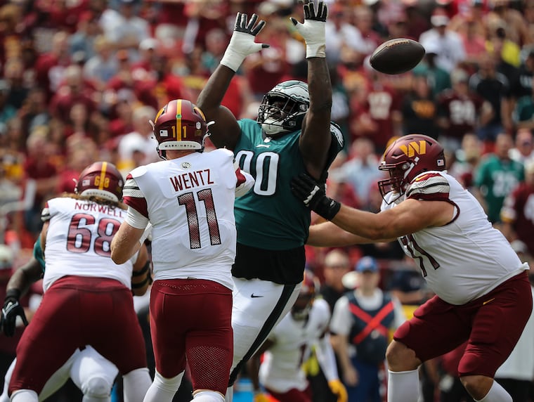 Defensive tackle Jordan Davis knocking down a pass attempt by Washington quarterback Carson Wentz in 2022.